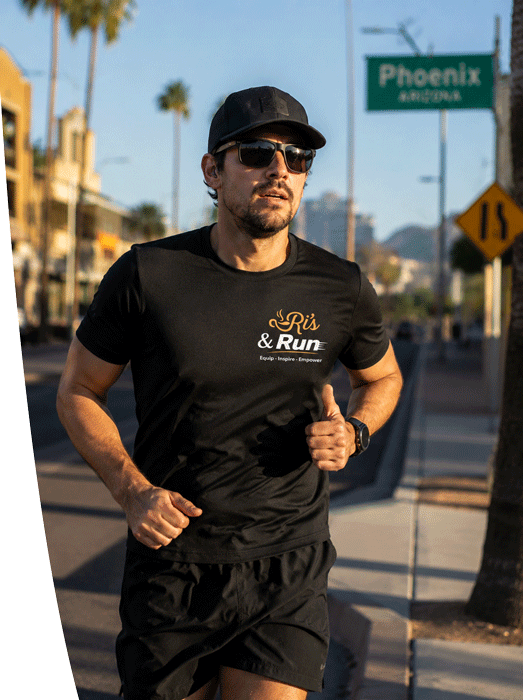 Runners on a desert road wearing Ri's & Run event t-shirts